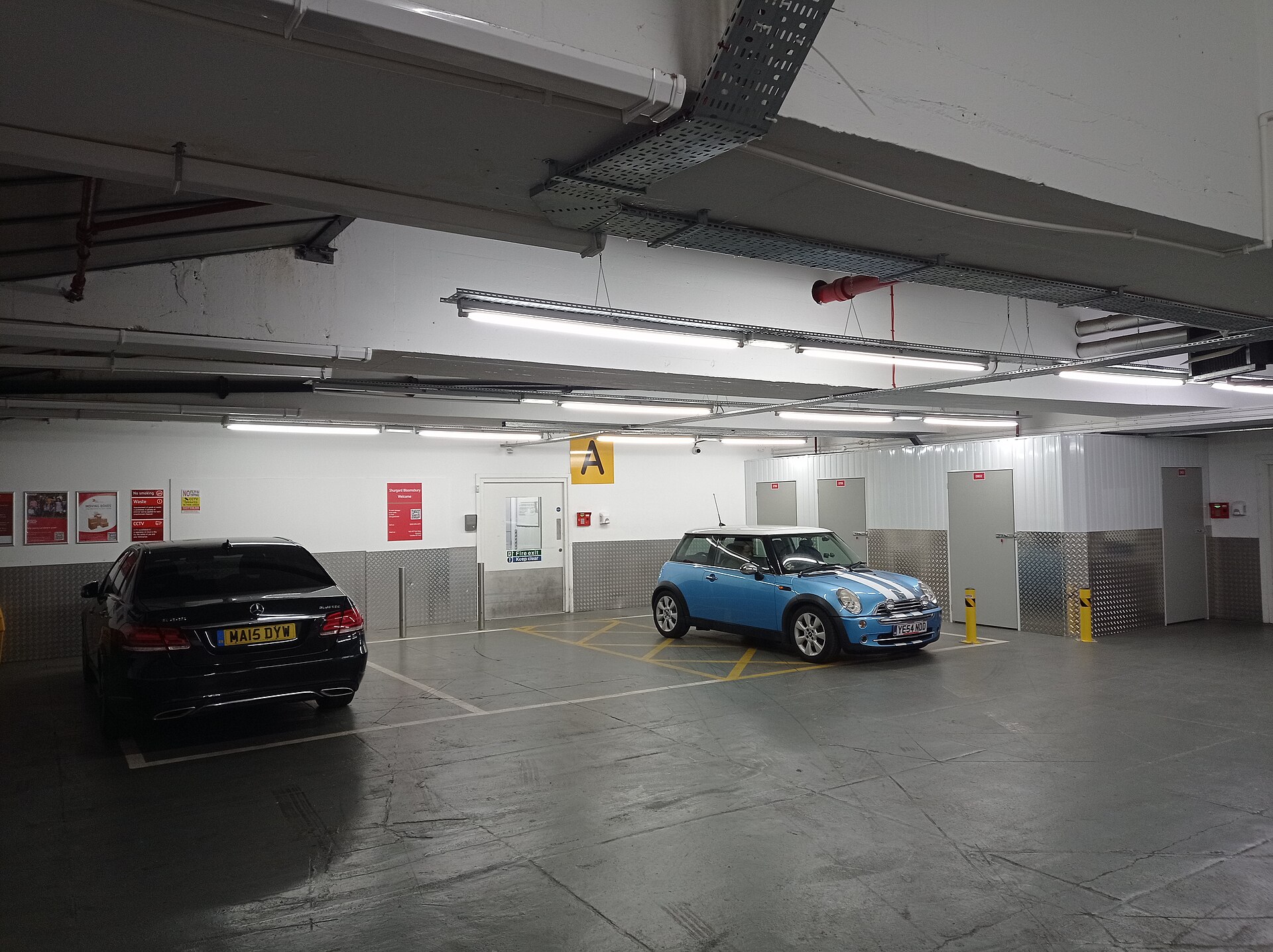 Covered vehicle access and storage units inside a self-storage center
